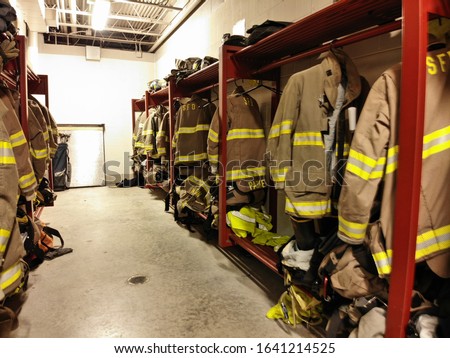 Pictures of fire gear hanging and firehose sitting at the ready.