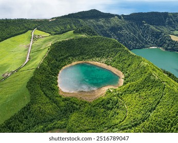 Picturesque aerial drone view of Lagoa Rasa and Lagoa Verde volcanic crater lakes. Turquoise water, forest and breathtaking green landscape. Sete Cidades, Sao Miguel, Azores, Portugal - Powered by Shutterstock