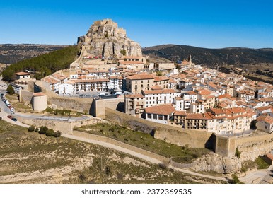 Picturesque aerial view of walled city Morella with medieval Castle on rocky hilltop, Castellon, Spain - Powered by Shutterstock