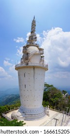 Picturesque Ambuluwawa Tower is a temple of four religions in Sri Lanka. The tower rises above the jungle on a high mountain. Center Ambuluwawa Biodiversity Complex, Gampola (near Kandy), Sri Lanka.