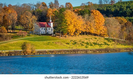 Picturesque Appalachian Country Church Overlooking A Lake On A Beautiful Autumn Day.