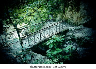 picturesque river footbridge with gate in europe