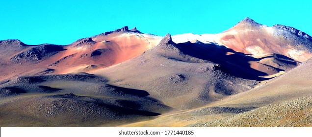 Picturesque colored mountains in the desert of Salvador Dali,Bolivia. Surrounded by towering volcanoes, rocks indiscriminately located on desert  the scene is surreal as were artist Dali's paintings. 