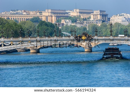 The picturesque embankments of the Seine River and Alexandre III bridge. Paris, France.