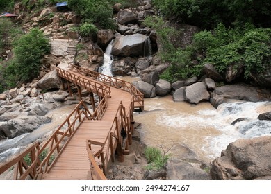 picturesque foot bridge of the river gorge at lodh waterfalls inside "palamou tiger reserve," latehar, jharkhand, india - Powered by Shutterstock