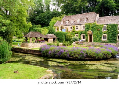 Picturesque garden in the Cotswold village of Bibury, England