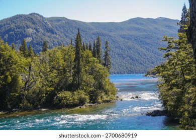 Picturesque landscape of the confluence of the Arrayanes River with the Menéndez and Verde lakes seen from the footbridge, Los Alerces National Park, Chubut, Argentina.