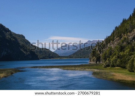 Picturesque landscape of the confluence of the Arrayanes River with the Menéndez and Verde lakes seen from the footbridge, Los Alerces National Park, Chubut, Argentina.