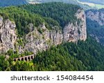 Picturesque landscape with viaduct of the Semmering railway in front of the Weinzettelwand, Semmering, Lower Austria. Completed in 1854, the railway is said to be the world