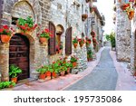 Picturesque lane with flowers in an Italian hill town                       