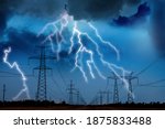 Picturesque lightning storm over field with high voltage towers