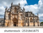 Picturesque main portal of medieval Santa Maria da Vitoria monastery church in Batalha, a manueline gothic masterpiece, Portugal