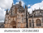 Picturesque main portal of medieval Santa Maria da Vitoria monastery church in Batalha, a manueline gothic masterpiece, Portugal