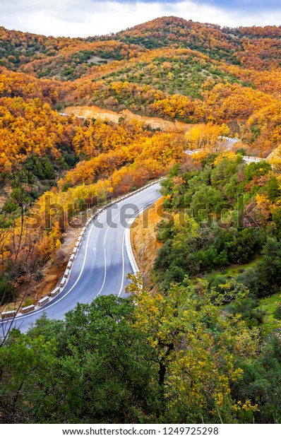 Picturesque mountain curved road in autumn. View\
from above. Meteora Rocks,\
Greece