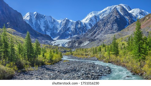 Picturesque Mountain Landscape, Altai, Russia. Gorge With A Mountain River, Rocky Slopes, Snow-capped Peaks. Summer Travel, Hiking. 