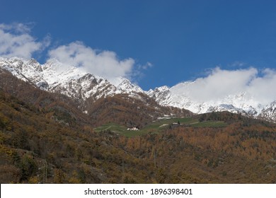 Picturesque Mountain Landscape In Naturns In South Tyrol In Autumn, In The Background The Snow-covered Mountains, Blue Sky With Clouds, No People