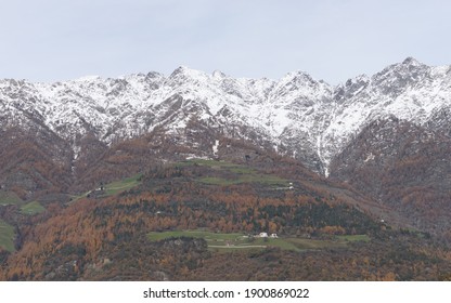 Picturesque Mountain Landscape In Naturns In South Tirol In Autumn, In The Background The Snow-covered Mountains, Blue Sky With Clouds, No People