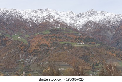 Picturesque Mountain Landscape In Naturns In South Tirol In Autumn, In The Background The Snow-covered Mountains, Blue Sky With Clouds, No People