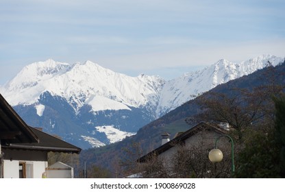 Picturesque Mountain Landscape In Naturns In South Tirol In Autumn, In The Background The Snow-covered Mountains, Blue Sky With Clouds, No People