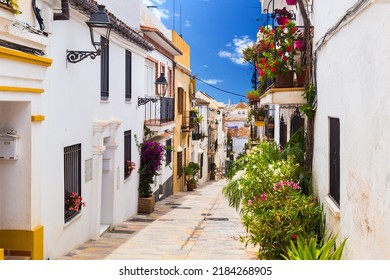 A picturesque narrow street in Marbella old town, province of Malaga, Spain.