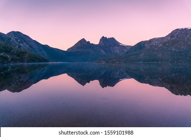 Picturesque nature background with Cradle Mountain and lake at sunrise with colorful sky and water reflection. Sunrise mountain background - Powered by Shutterstock