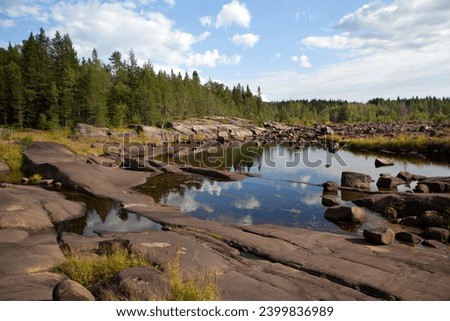 Picturesque nature through forests and lakes along the eco-trail from the village of Vygostrov to Zavalruga, to the White Sea petroglyphs. Belomorsky district. Republic of Karelia. Russia
