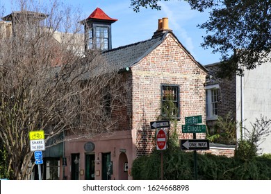 A Picturesque Old Brick Building At  With A Glass Cupola And Double Terra Cotta Chimney Pipes, On East Bay Street In Charleston, SC.