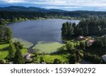 Picturesque Phantom Lake and the surrounding sprawling communities of Robinswood, Lake Hill and West Lake Sammamish in Bellevue, Washington.