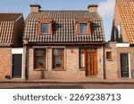 picturesque residential houses in the Dutch fishing village of Urk in Netherlands. iconic archicture of buildings in holland more specific to Flevoland. Coastal homes where local people live