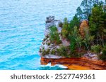 Picturesque rock formations at Porcupine Mountains Wilderness State Park, USA, showcasing rugged terrain and natural beauty. An ideal shot for adventure seekers and nature enthusiasts.