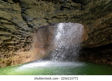 Picturesque Saltinsky underground waterfall in cave in nature park at Dagestan. - Powered by Shutterstock