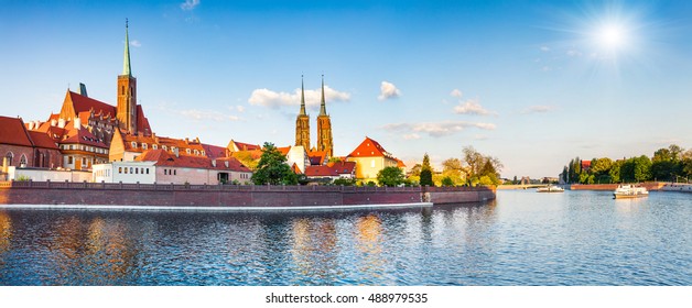 Picturesque scene of famous Tumski island with cathedral of St. John on Odra river. Colorful spring landscape in Wroclaw, Poland, Europe. Artistic style post processed photo.