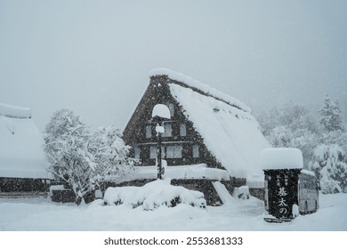 A picturesque scene of a traditional Japanese house with a thatched roof surrounded by heavy snowfall, capturing the serene beauty and tranquility of winter in a remote village.