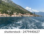 Picturesque small town of Perast nestled along the shores of Kotor Bay, surrounded by stunning mountains, Montenegro