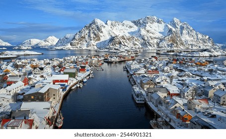 Picturesque snowy village along a fjord with colorful houses, framed by towering snow-capped mountains under a bright blue sky. - Powered by Shutterstock