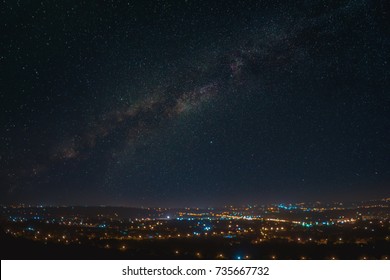 The Picturesque Starry Sky Above City. Night Time