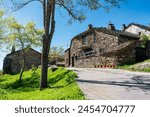 Picturesque stone houses on a blue sky day in Campillo de Ranas, Guadalajara.