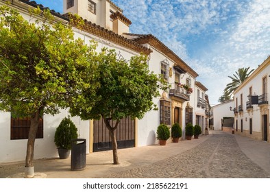 A picturesque street and white houses near Puente Nuevo Bridge in Ronda, Spain