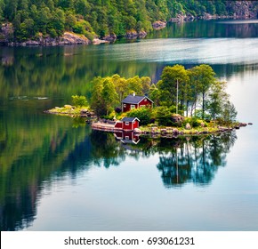 Picturesque Summer View With Small Island With Typical Norwegian Building On Lovrafjorden Fjord, North Sea. Colorful Morning View In Norway. Beauty Of Nature Concept Background.