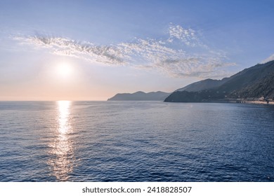 Picturesque sunset over the sea and mountains. the silhouettes of the mountains. nature.
