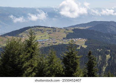 Picturesque Trabzon Highland Village: A Stunning View of Green Valleys, Pine Forests, and a Serene Lake Nestled Among Rolling Hills - Powered by Shutterstock