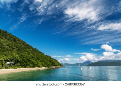 Picturesque tropical coral beach with turquoise water on Fitzroy Island. It is a continental island southeast of Cairns, Queensland, Australia. - Powered by Shutterstock