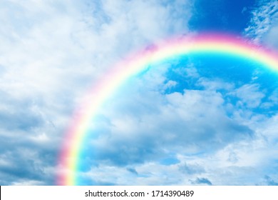 Picturesque View Of Beautiful Rainbow And Blue Sky On Sunny Day 