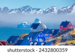 Picturesque village on coast of Greenland - Colorful houses in Tasiilaq, East Greenland