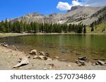 picturesque  wheeler peak, pyramid peak, and jeff davis peak on a sunny  summer day across stella lake  along the alpine lakes loop trail in great basin national park near baker, nevada