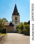 Picturesque white parish church on bright sunny day in summer, Cergnat, Ormont-Dessous, Vaud canton, Switzerland