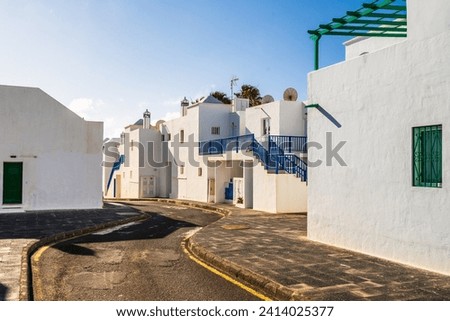 Picturesque whitewashed architecture with green elements in Costa Teguise, Lanzarote, Canary Islands