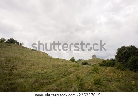 Pidkamin inselberg stone on hill landscape. Ukraine.