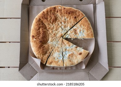 Pie With Cabbage In A Cardboard Box. Traditional Cuisine. Food Delivery Concept. Vegetarian Fresh Baked Pie. Restaurant Fast Food Takeaway Or Delivery. Eat Outside