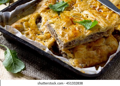 Pie With Meat (minced Meat And Puff Pastry) On Vintage Wooden Background.